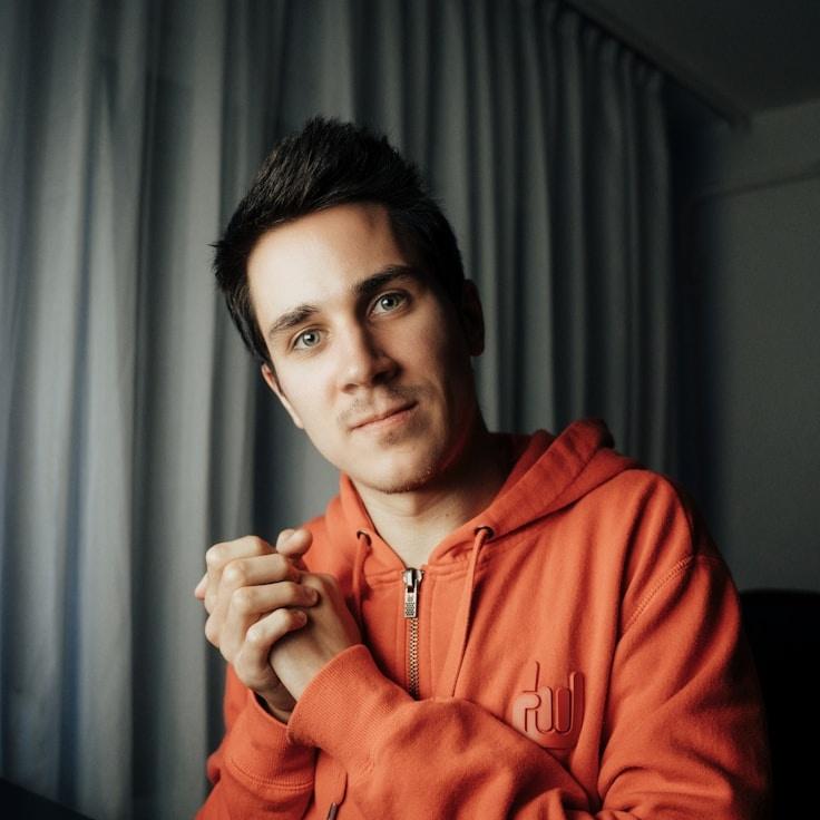 Alex Rivera, Lead Design Curator at Modular Wealth Node, reviewing corporate floral arrangements